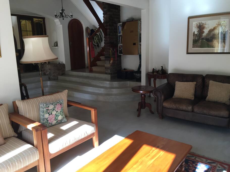 Folding doors open onto patio overlooking lovely garden