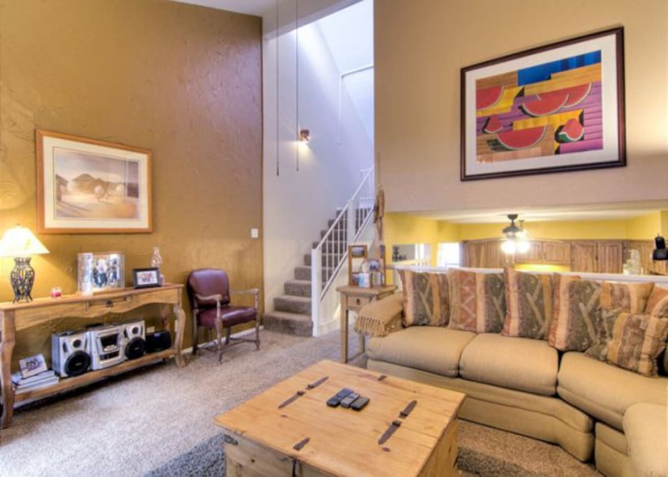 The family room leads upstairs to the loft bedroom.