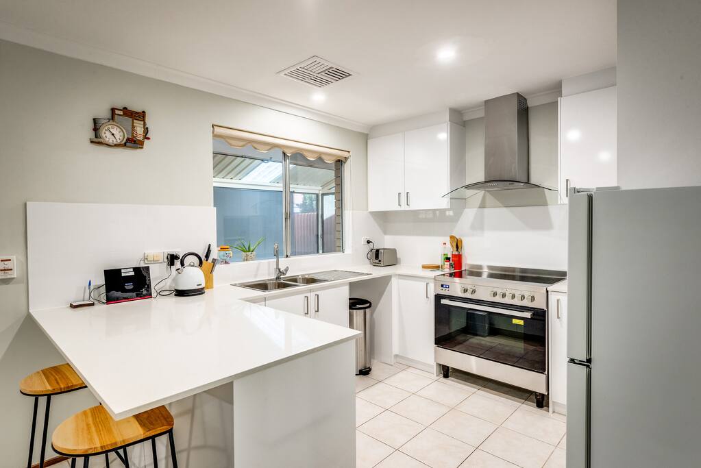 Modern kitchen with granite top and ceramic stove/oven