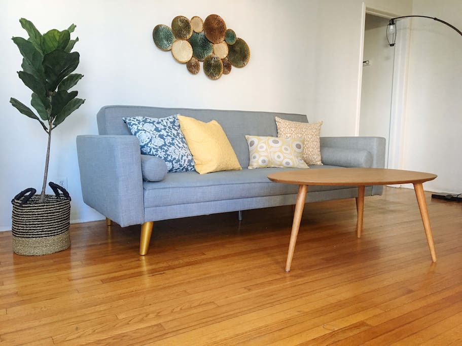 Mid century sofa turns into a bed. Fold the back to lie flat. We have 2" memory foam mattress pad to added comfort.
