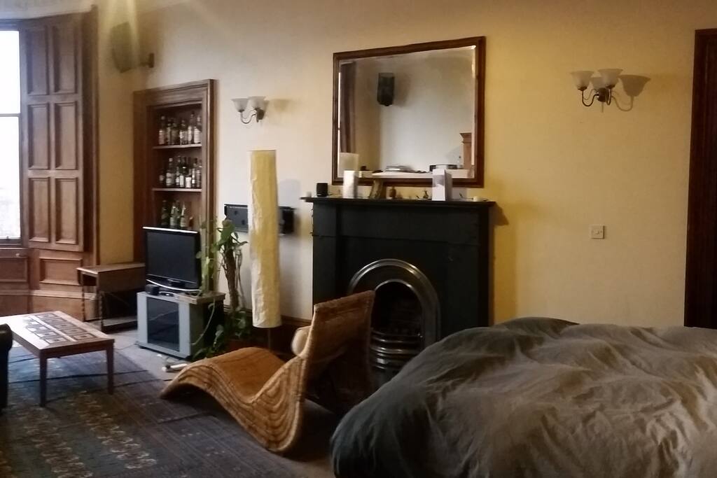 TV, chaise lounge and fireplace