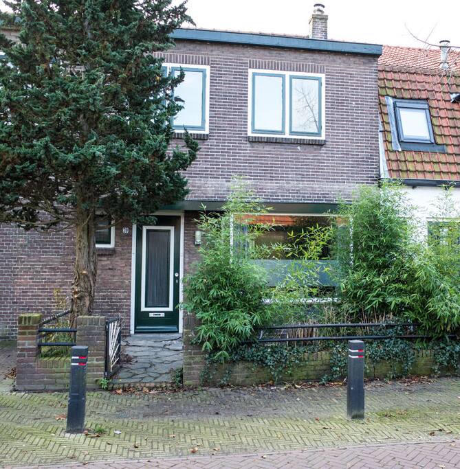 Front of the house. Your room is upstairs right window.