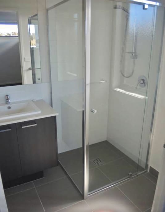 Your private ensuite is functional and compact, combining shower, sink and toilet.