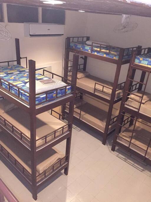 A larger view of the room. Beds are bolted to the wall for added stability.