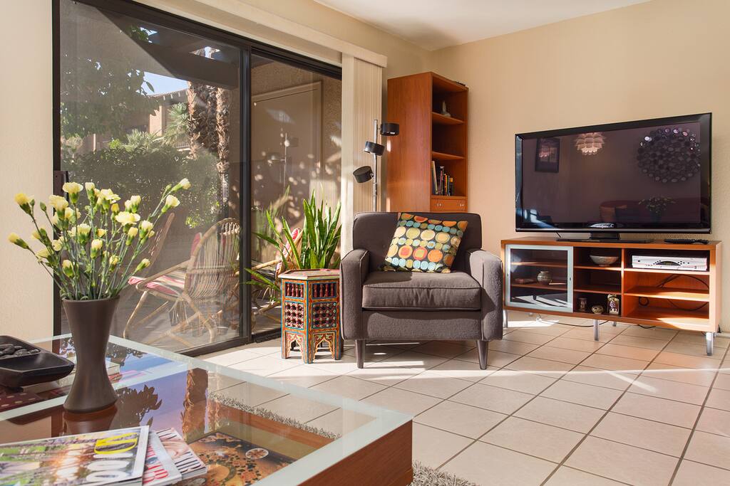 The living room boasts a 52" flat-screen TV. And yes, cable/HBO is included.