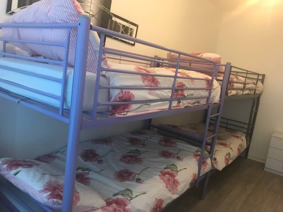 Clean and cosy bedroom for 5 with large window, full length mirror, side table and chest of drawers