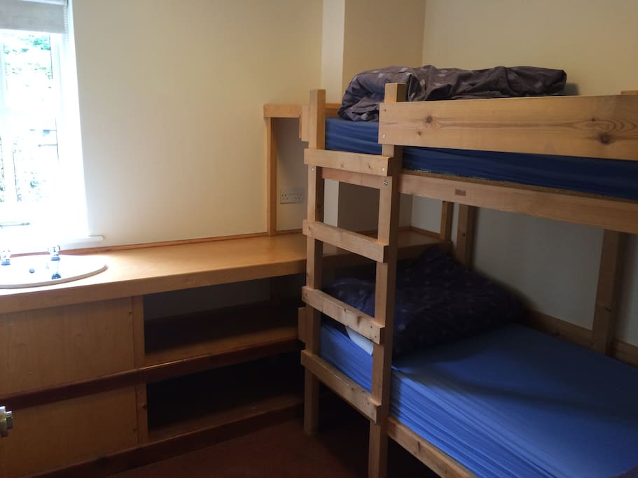 One of the 7 bedrooms with bunk beds (2 sleep in 1 room)