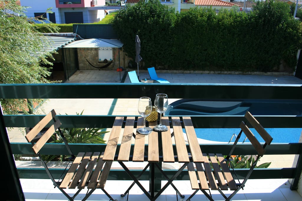 Looking down onto the pool from the apartment's balcony