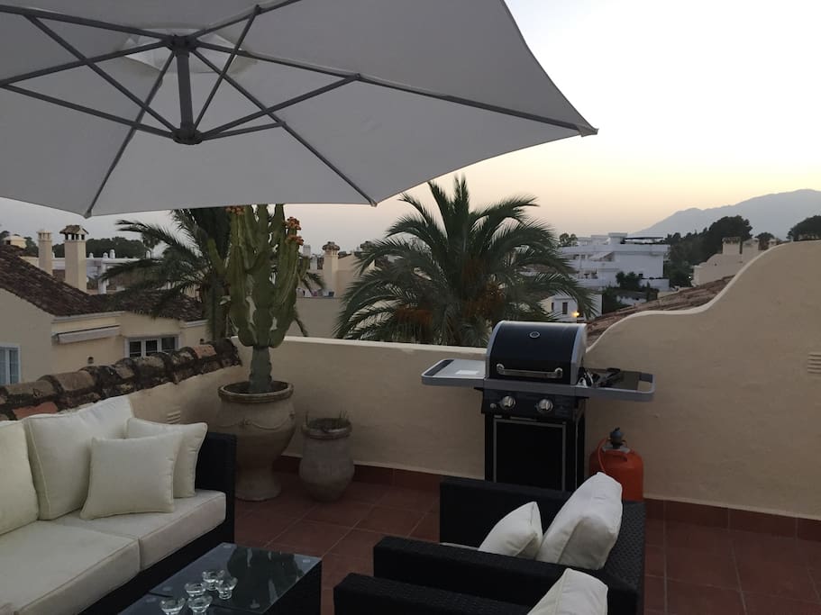 Fantastic lounge area on rooftop terrace with barbecue and sea view