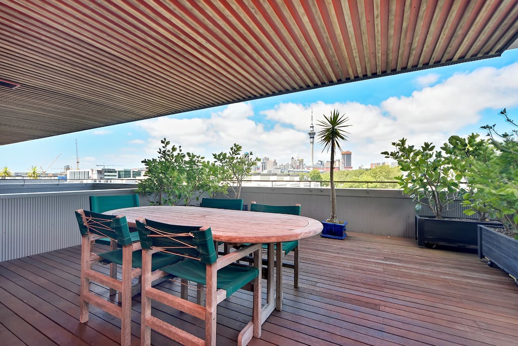 Large rooftop deck with views of Victoria Park and the city skyline