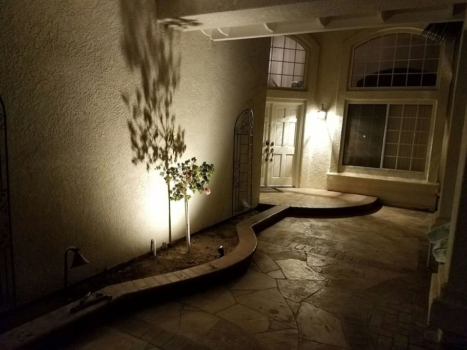 Brightly lit entryway at night.