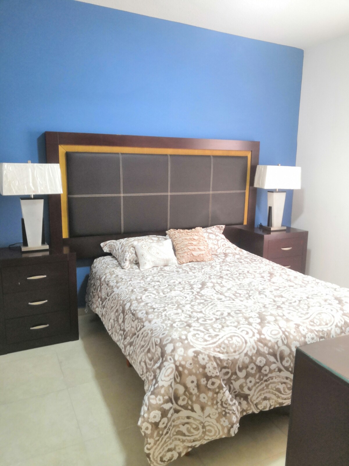 Bedroom with queen-size bed. 