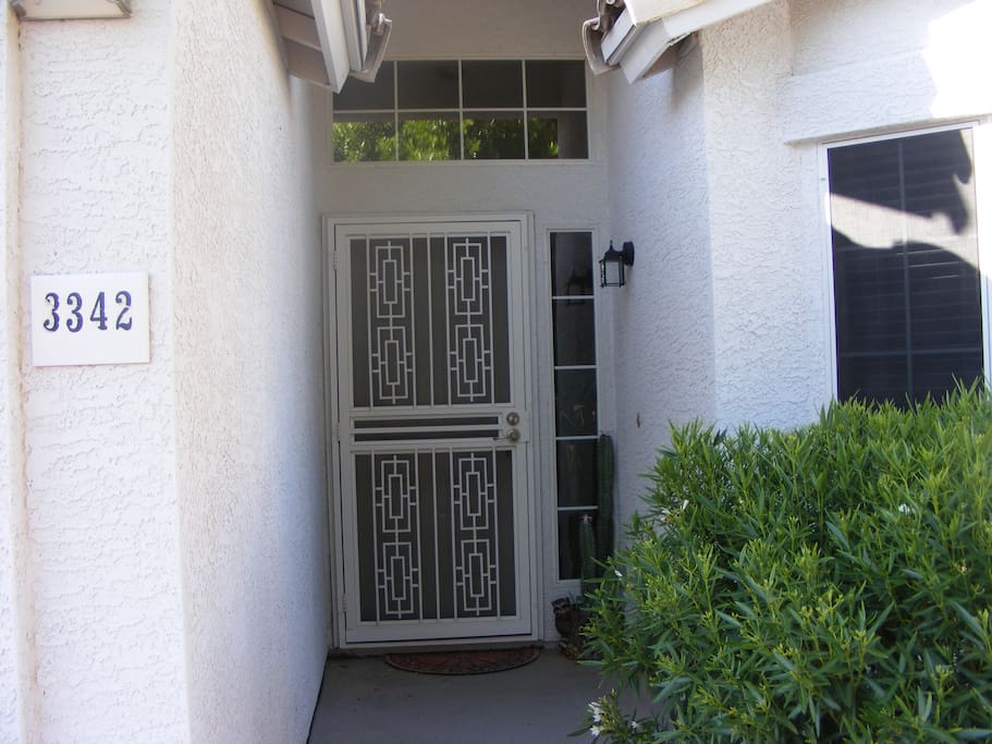 Double front door including metal screen door for added security.
