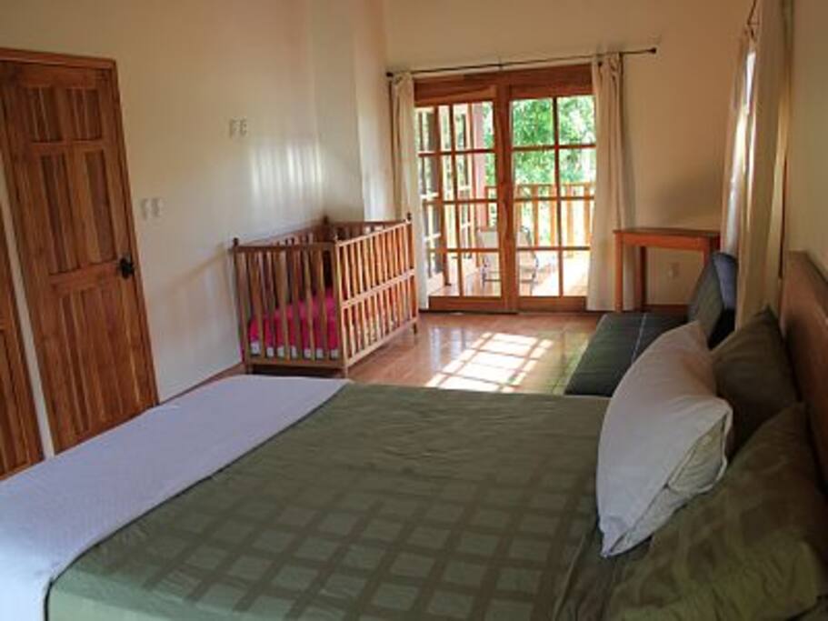 Master bedroom, queen bed, crib, futon, ensuite bathroom