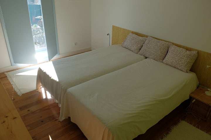 Bedroom 1, lined with two beds 90 x 200 cm, storage and full bathroom