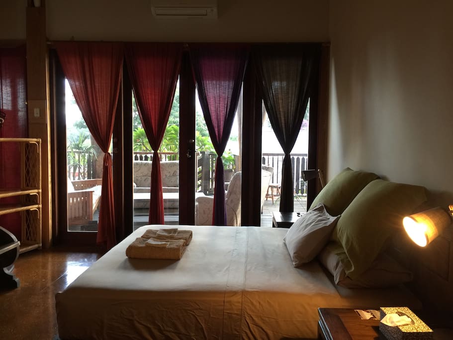 Back bedroom with super comfortable King size hardwood bed.