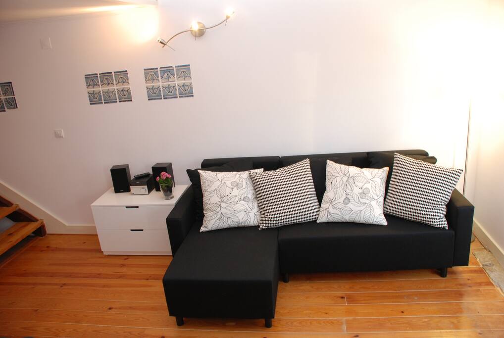 Sofa bed with chaise-longue