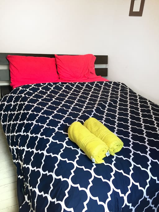 The big bedroom with a queen-size bed