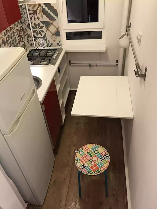 kitchen with fridge and cooker