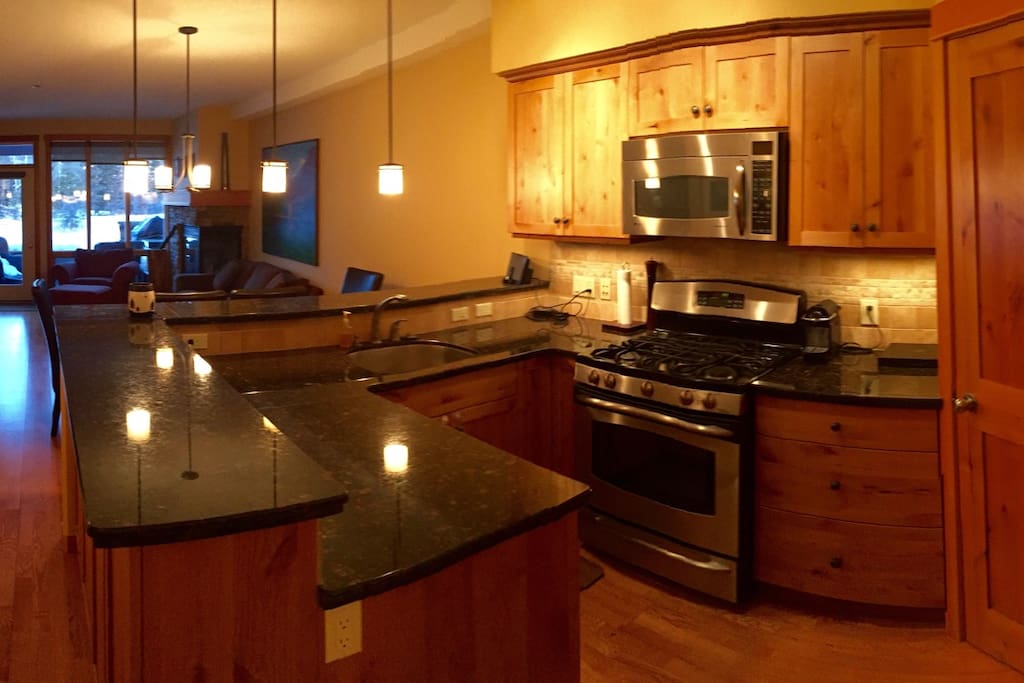 Kitchen has marble counter tops and bar, gas stove, stainless steel appliances, Nespresso coffee maker and corner pantry. Great for cooking in and hosting. Private entrance to entry and patio