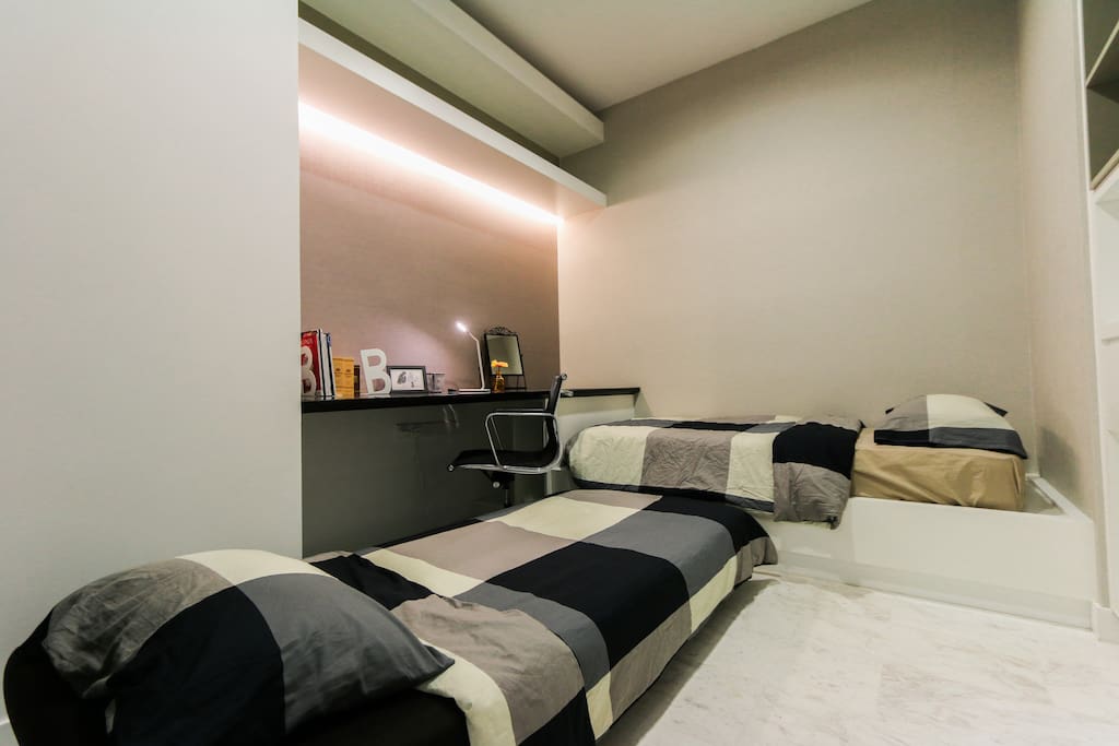 Unit 1: a single bed and a single sofa bed in the common room