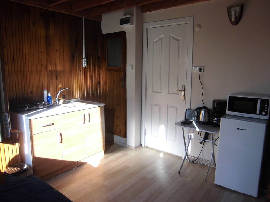 Entry door and the kitchen.