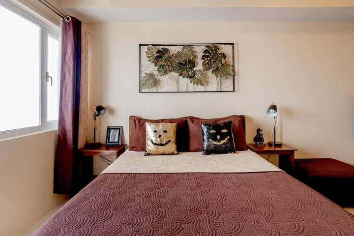 The Bed - a 60-inch high, PREMIUM quality slumber haven for your utmost comfort. Very inviting and very comfy and fitted with hotel-quality mattresses and sheets. Perfect to doze off on, after a busy day.