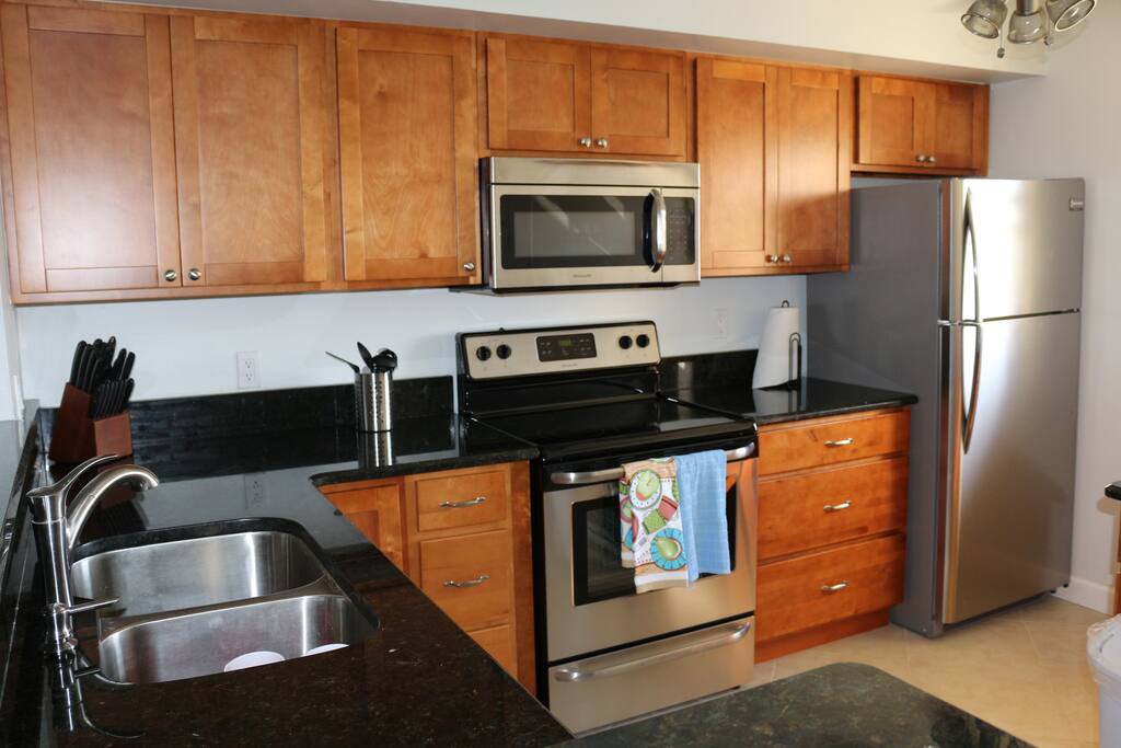 Fully equipped kitchen. Granite countertops and stainless steel appliances.