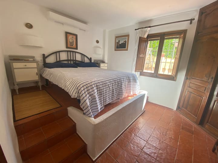 Master bedroom with fan and reclining electric bed