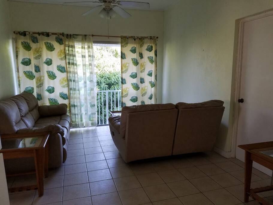 Enjoy the tropical views from the living room from this upper floor apartment