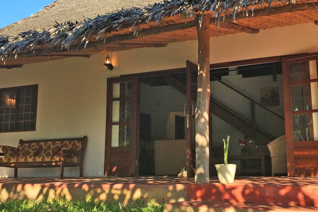 Veranda overlooking leafy garden