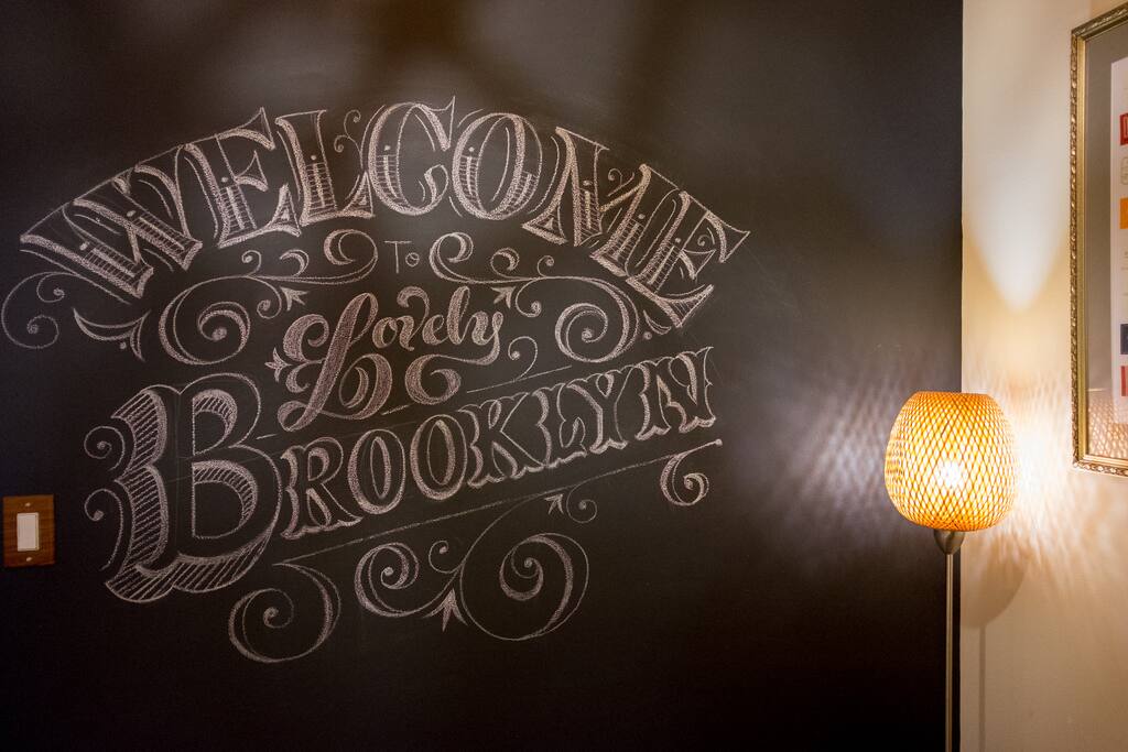 Custom chalk lettering mural in the reading nook