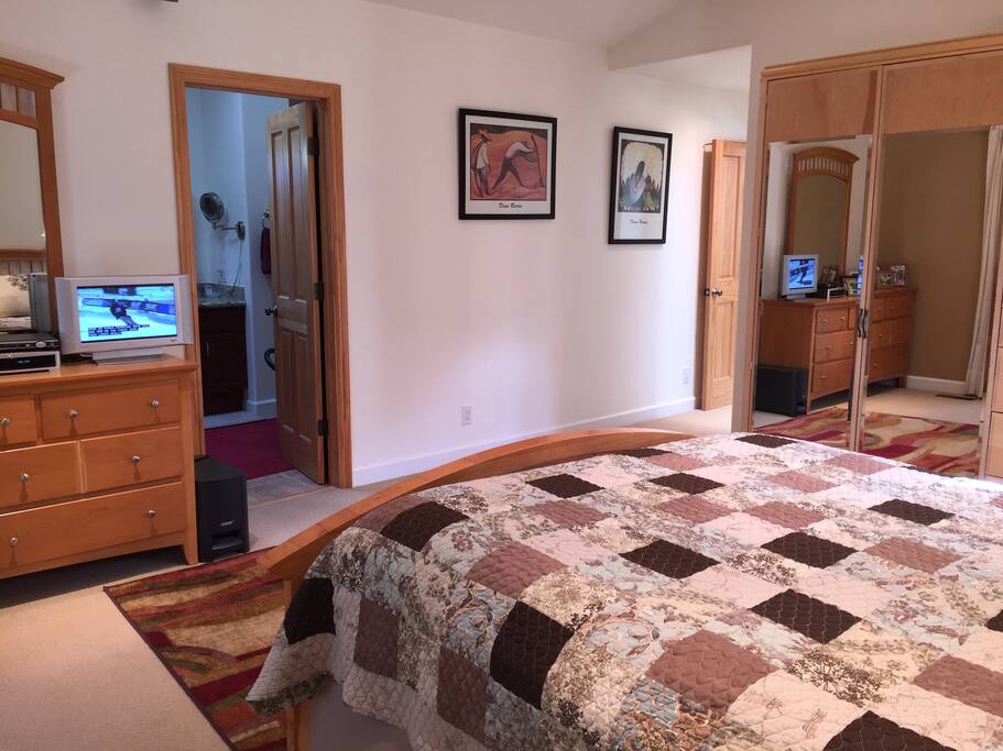 Roomy master bedroom that invites to relax