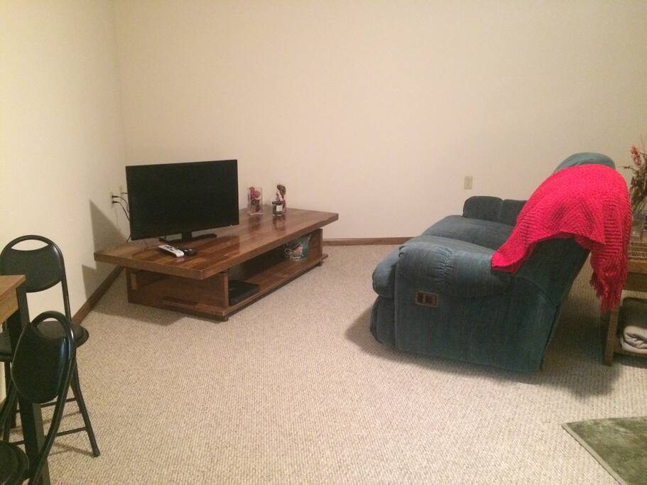 View of sitting area, queen size bed to the right.