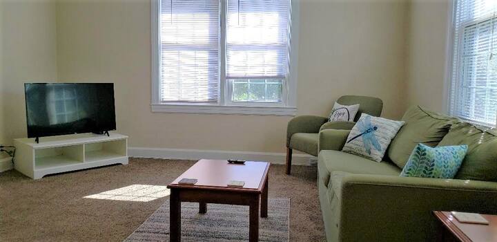 Comfortable sitting area with pull out couch. Lots of natural light from the surrounding windows. 
