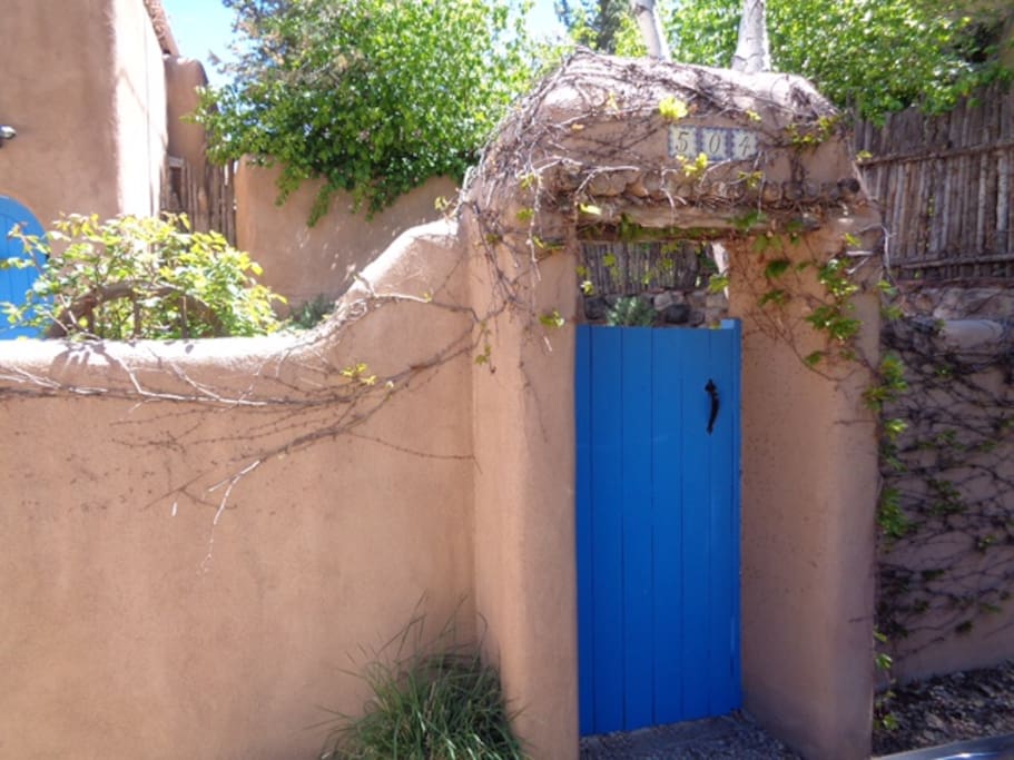 Hello! The proverbial Santa Fe blue gate greets your arrival.