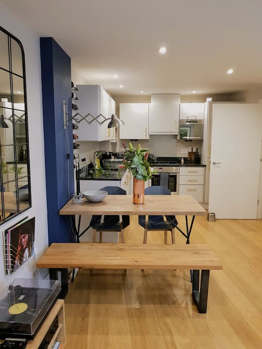 The dining area, with kitchen beyond