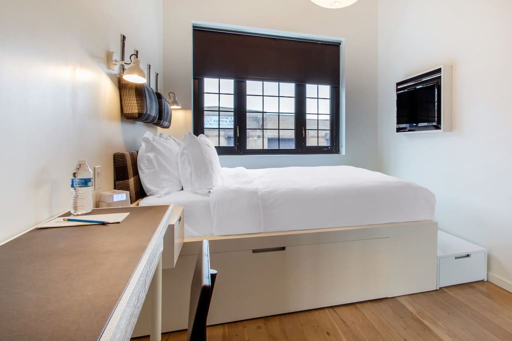 Flatscreen TV And Desk In Room