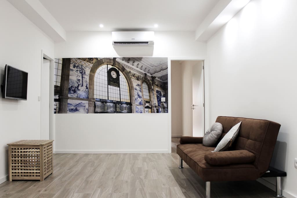 Sala de estar com sofá cama