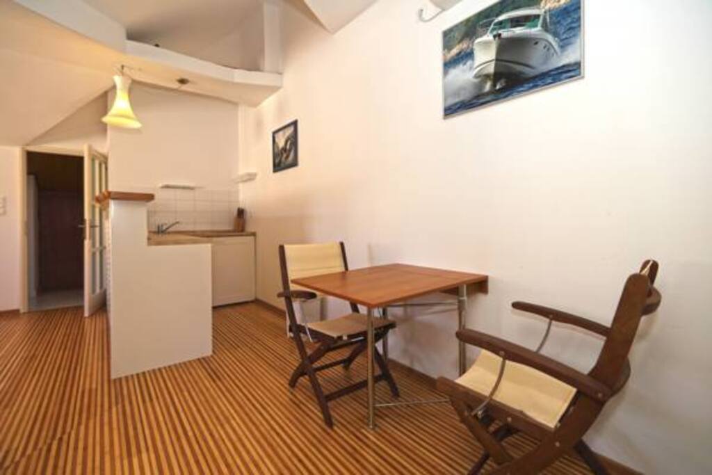 Kitchen/Bar with a small dining table for two.