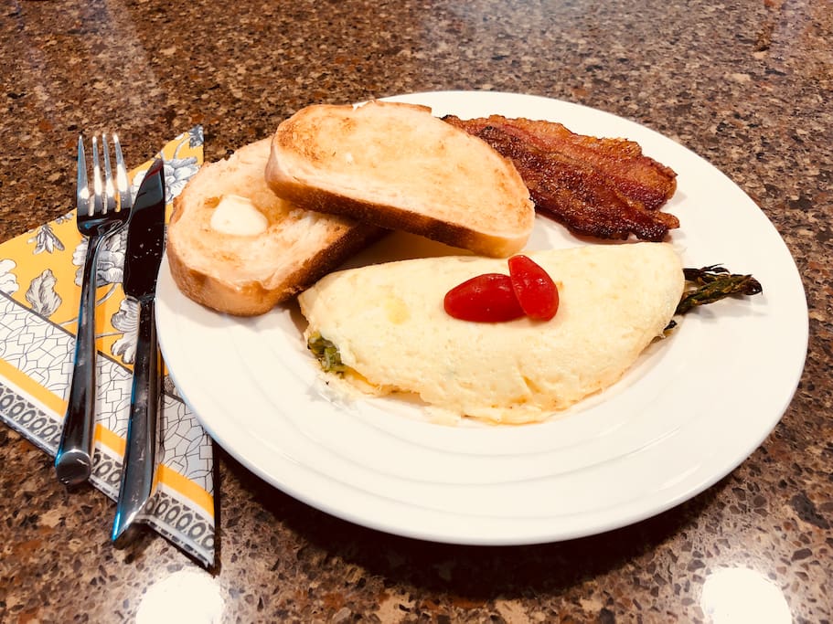 Asparagus and bocconcini omelet with potato bread toast and Applewood bacon!