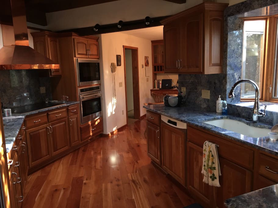 Beautiful Kitchen w/ Blue Granite Counter-tops, Wolf built in Ovens & Cook-top - Sub-Zero Refrig.