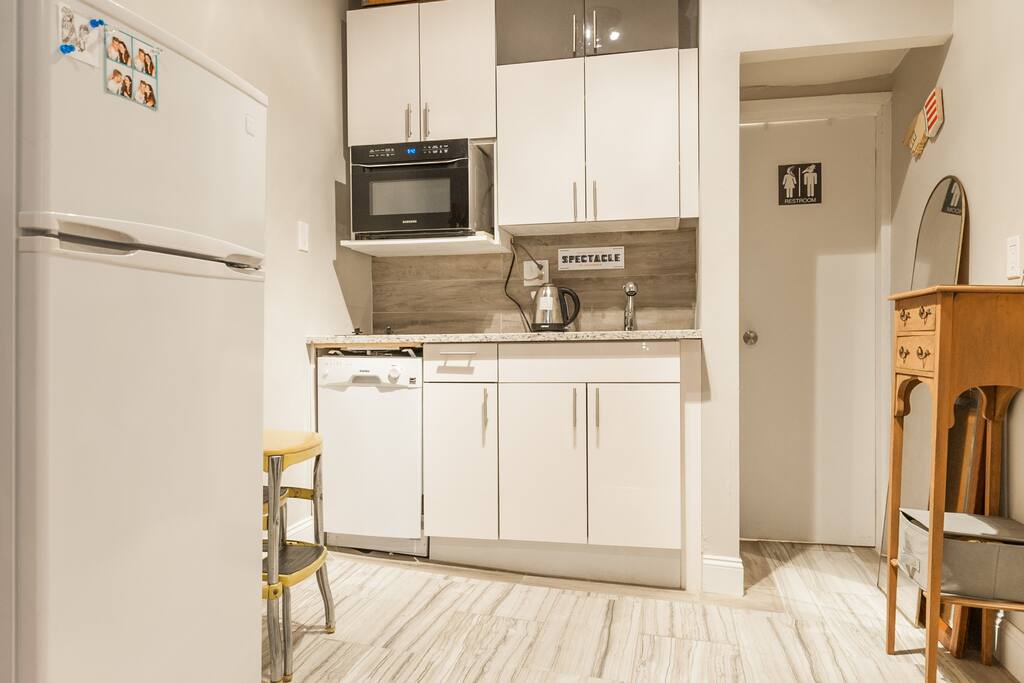 The kitchenette.  Features dishwasher, full fridge, sink, and convention oven.  We also have a toaster and hot water pot availble for your use.
