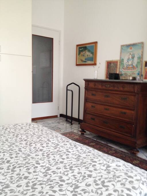 The white cabinet has space for your clothes.