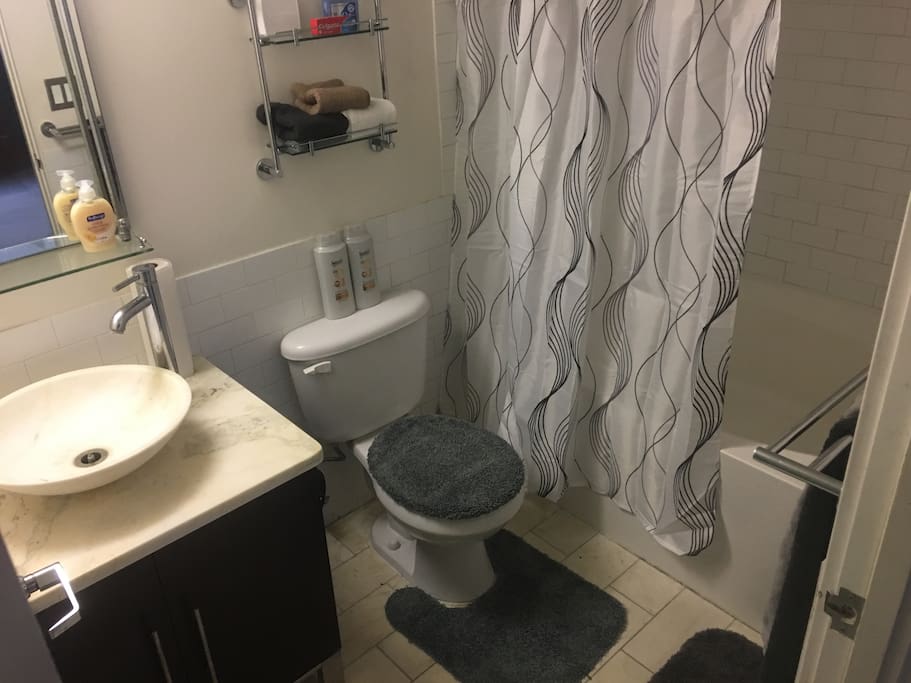 Personal Bathroom with shower and Tub. Great for long bathes. Inside of Room.