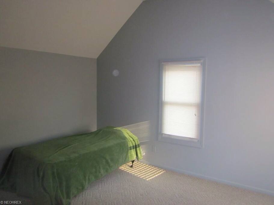 Upstairs bedroom, pictured with twin bed but can be swapped out for queen, can request to keep both beds in the room. New linen will be purchased for beds.