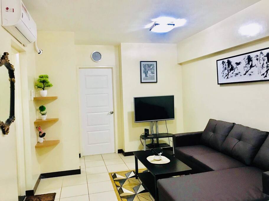 This is a combined living room and dining area with brand new split type air conditioning.
