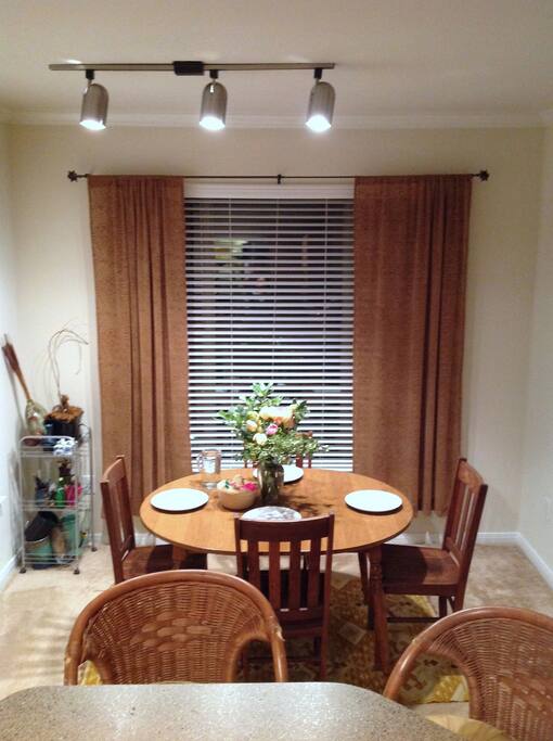 Dining area seats four with treetop views and lots of natural light.