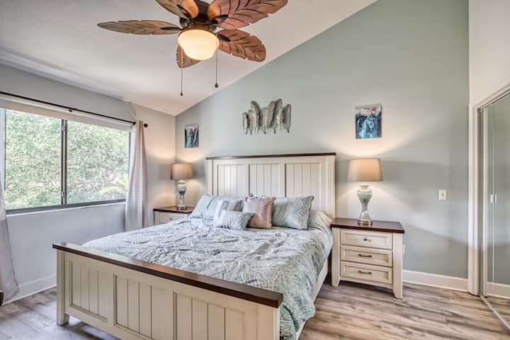 King bed with lots of closet and drawer space, ceiling fan, and direct access to the bathroom.
