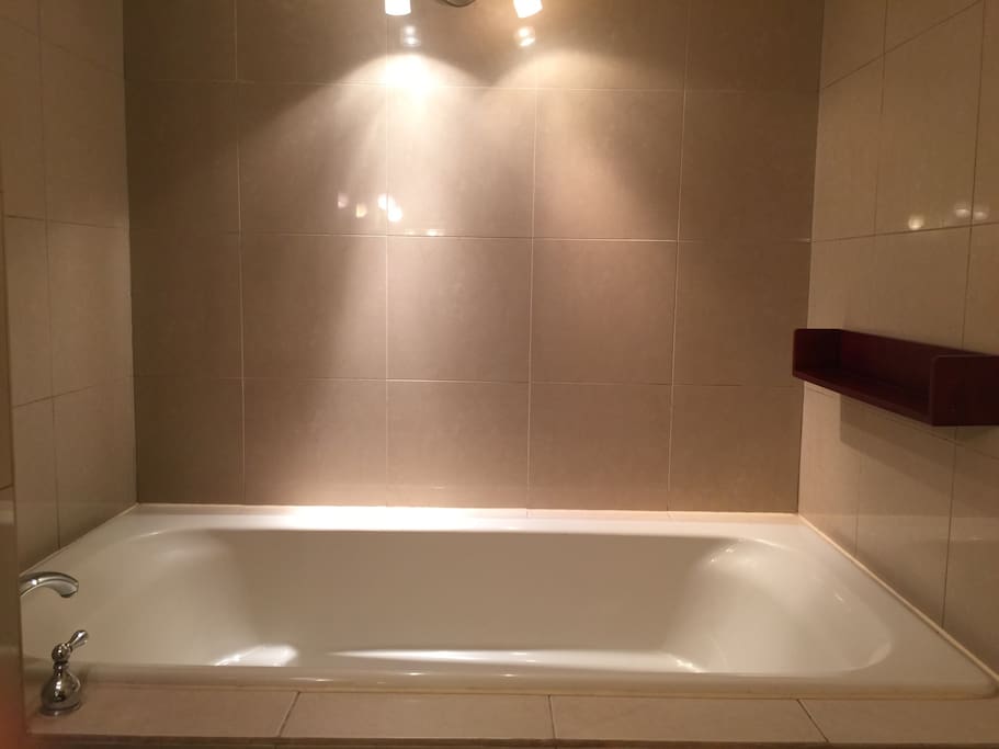 A whole tub is waiting for your pleasure and relaxation at the end of the day.